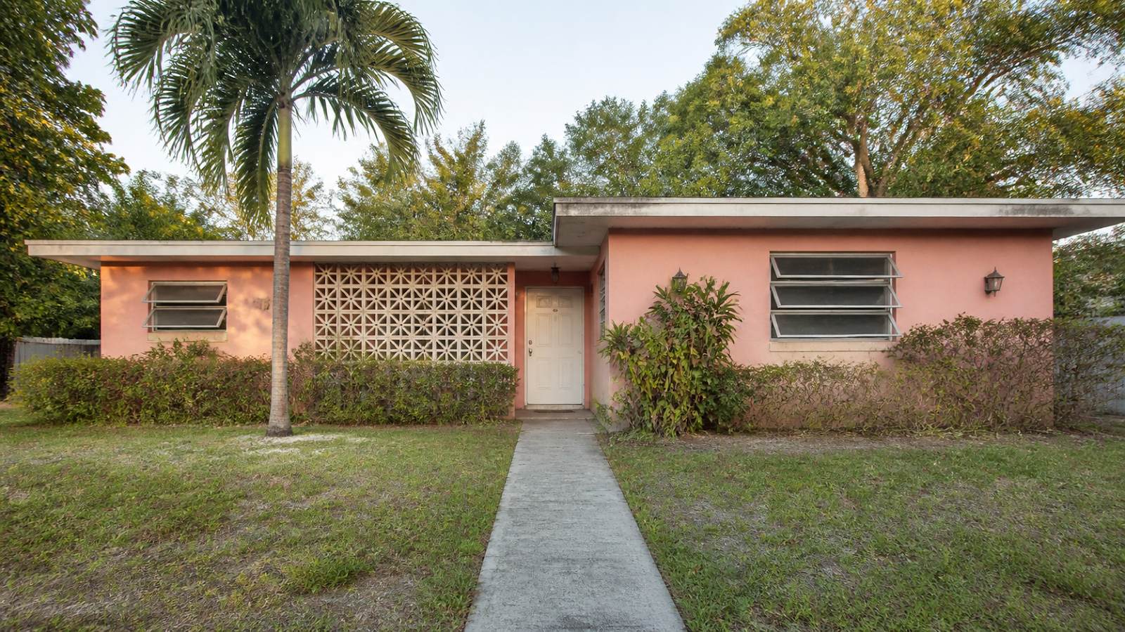 Pink mid-century Florida ranch before Vision Boost